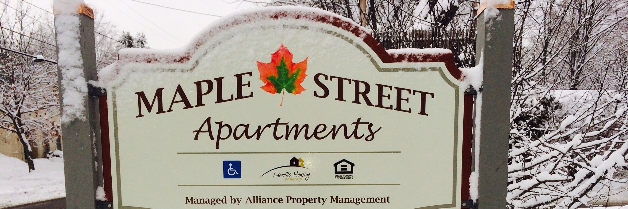 maple street apartments sign