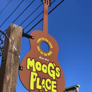 guitar sign for moog's place